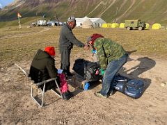 02A Weighing our duffle bags to be carried by horses from Base Camp to Ak-Sai Travel Lenin Peak Camp 1 4400m